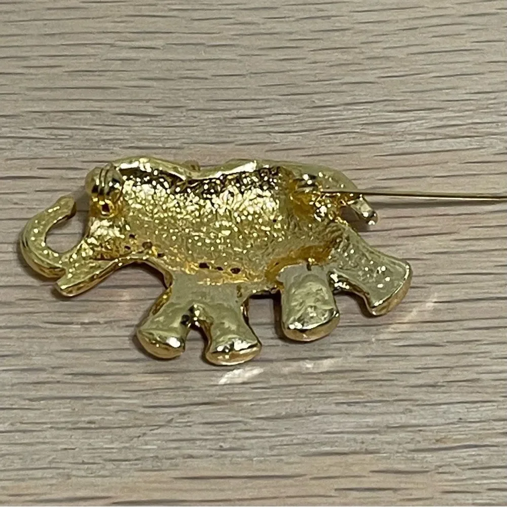 Elephant Rhinestones Brooch Gold Tone Green Gem Eye Blue Enamel Saddle Trunk Up